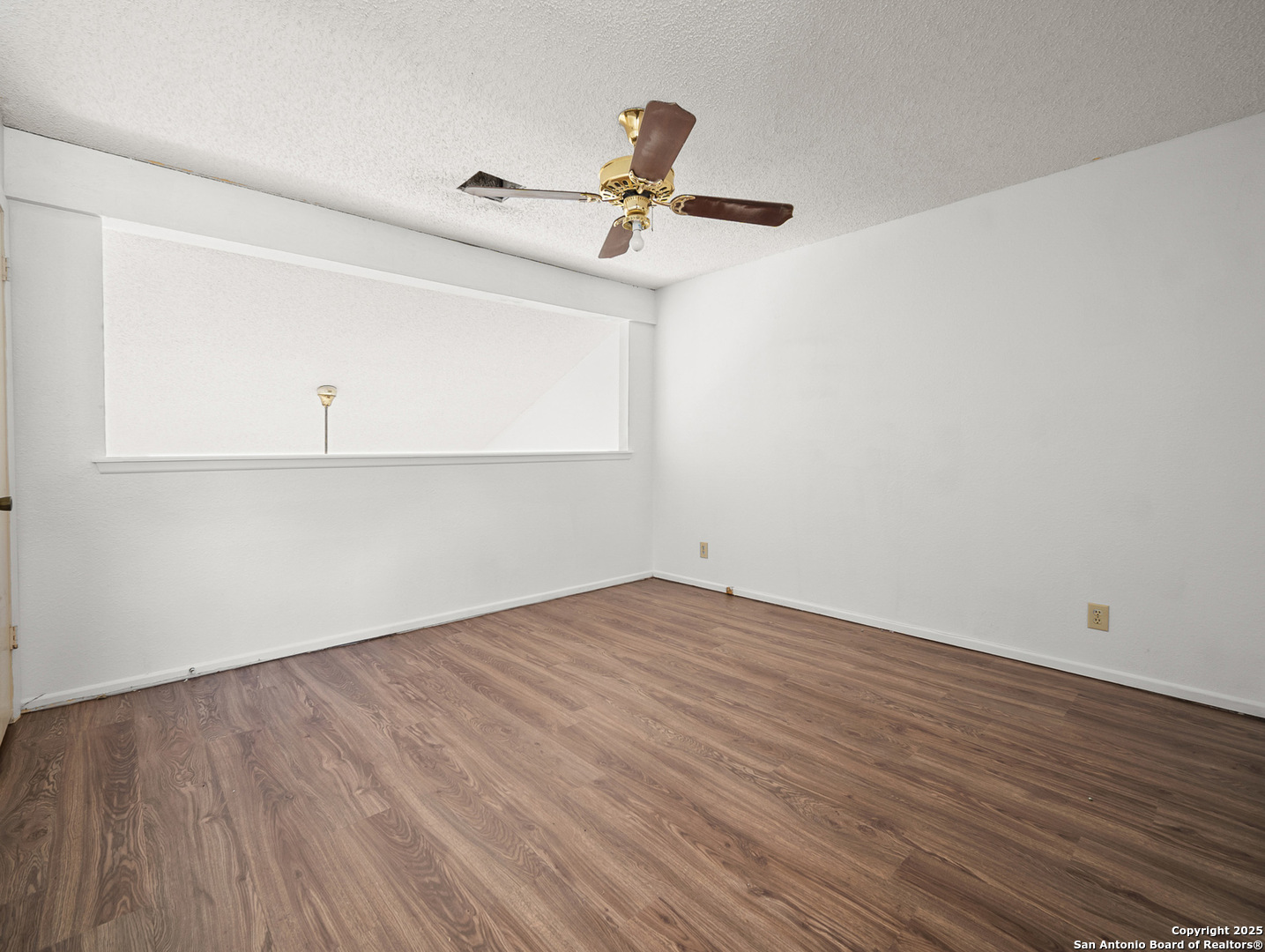 11520 Huebner Road, Unit 302 San Antonio, TX 78230 - Photo 17 of 28 a view of a room with wooden floor and cabinet
