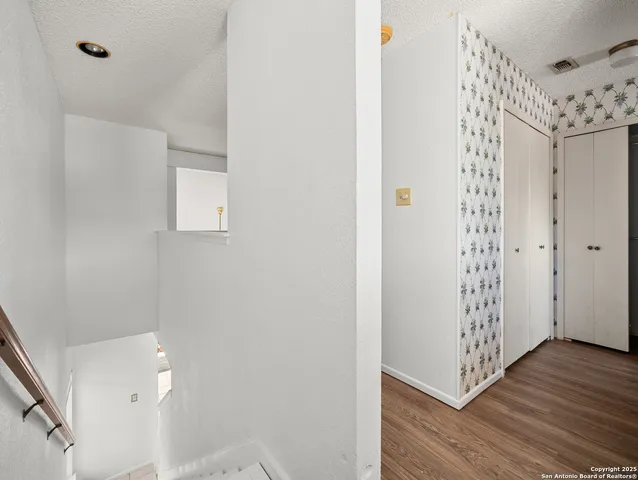 a room with a cabinets and a wooden floor