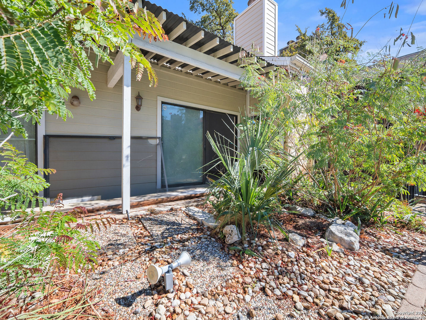 11520 Huebner Road, Unit 302 San Antonio, TX 78230 - Photo 26 of 28 a house with a tree in front of it