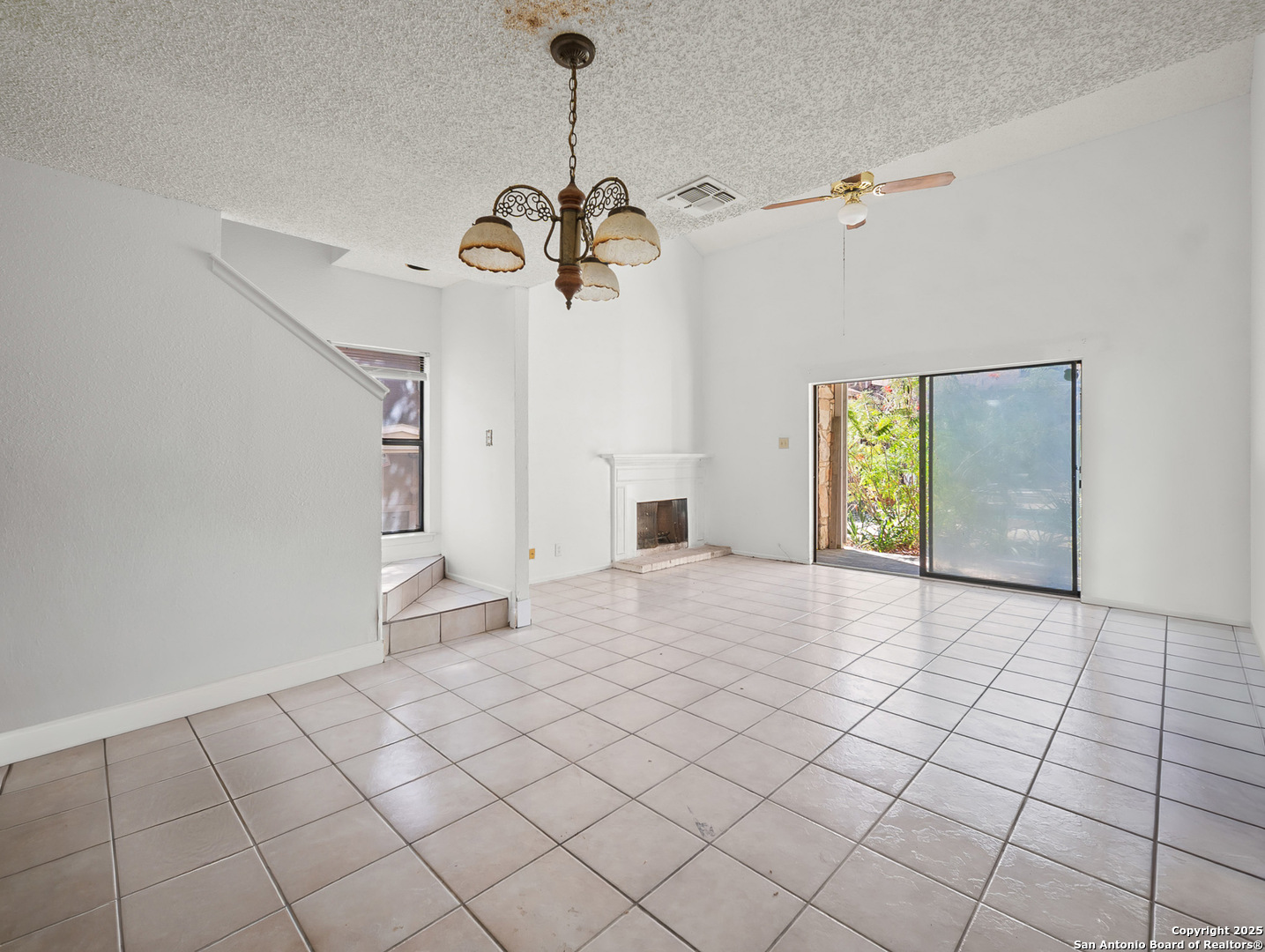 11520 Huebner Road, Unit 302 San Antonio, TX 78230 - Photo 7 of 28 a view of a livingroom with a chandelier furniture and windows