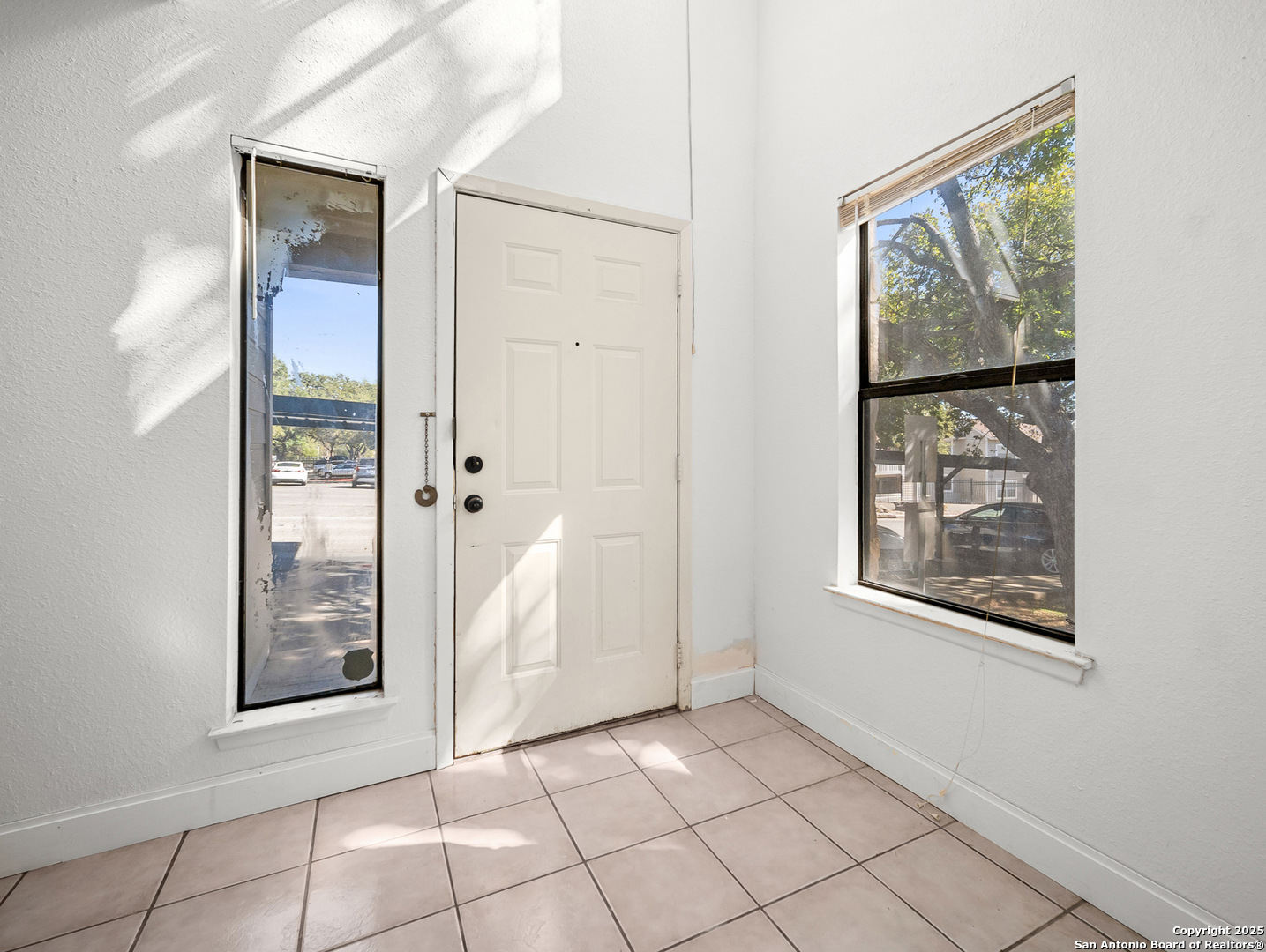 11520 Huebner Road, Unit 302 San Antonio, TX 78230 - Photo 8 of 28 an empty room with windows and closet