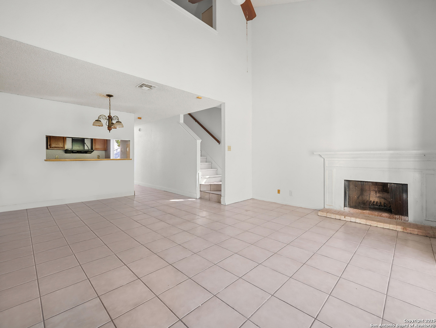 11520 Huebner Road, Unit 302 San Antonio, TX 78230 - Photo 9 of 28 a view of a livingroom with furniture and a ceiling fan