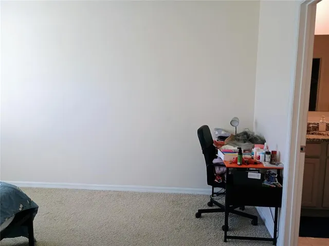 a workspace with furniture and a window