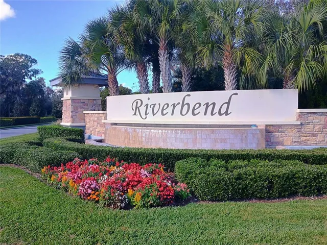 a sign that is sitting in front of flowers