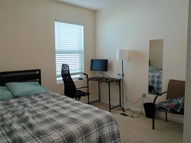 a bedroom with a bed and a cabinets