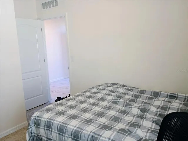 a view of a balcony with furniture