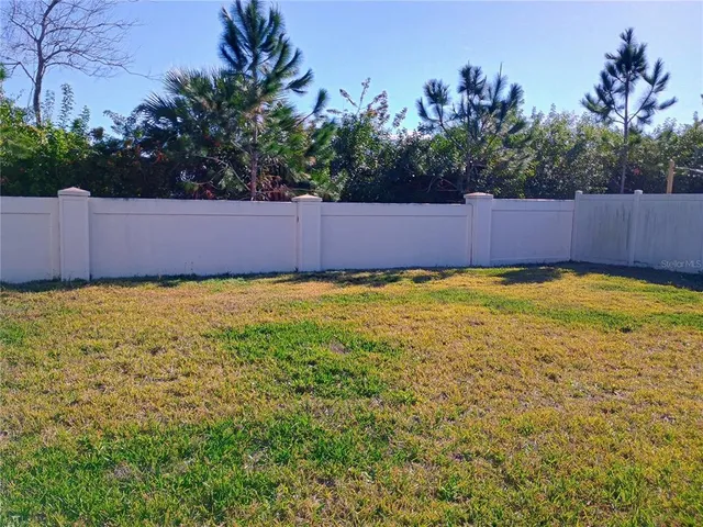 a view of a swimming pool and lounge chairs