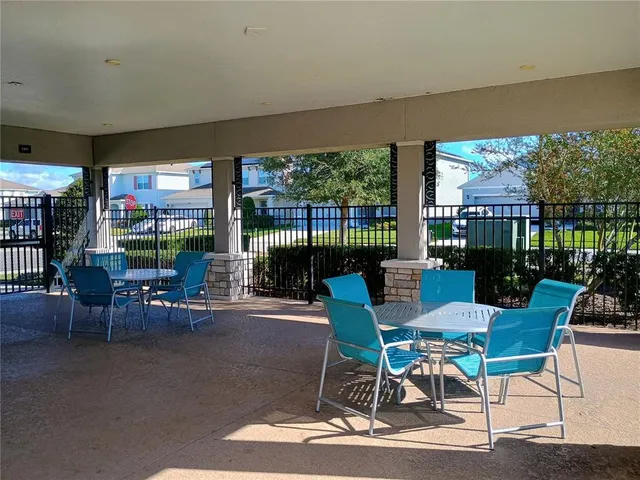 a front view of a house with a yard table and chairs