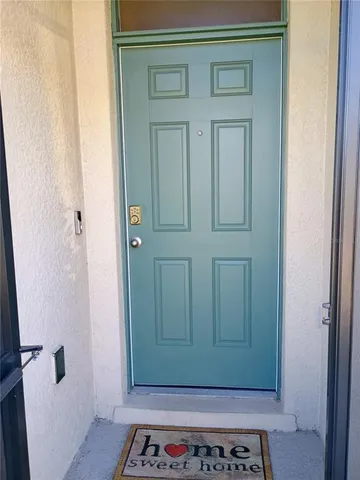 a view of a bathroom with a sink and a mirror
