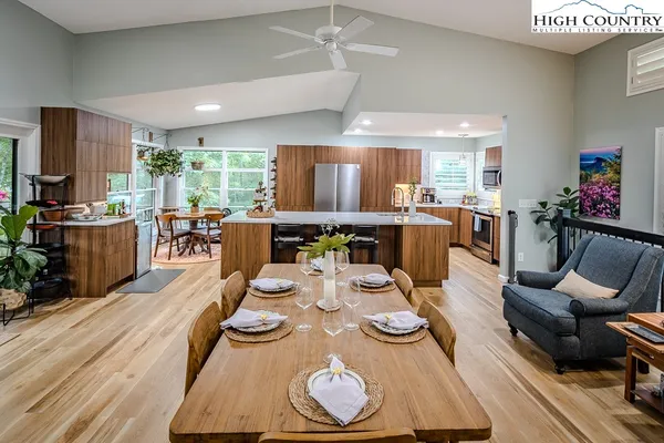 a view of a dining room with furniture window and wooden floor