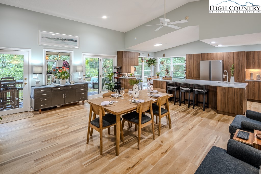 710 Pine Ridge Road Beech Mountain, NC 28604 - Photo 15 of 42 a outdoor dining space with furniture window and wooden floor