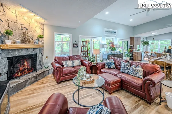 a living room with furniture a window and a fireplace
