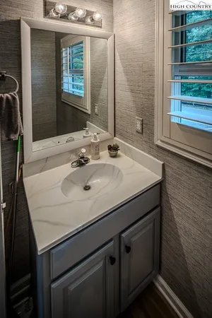 a bathroom with a sink and a mirror