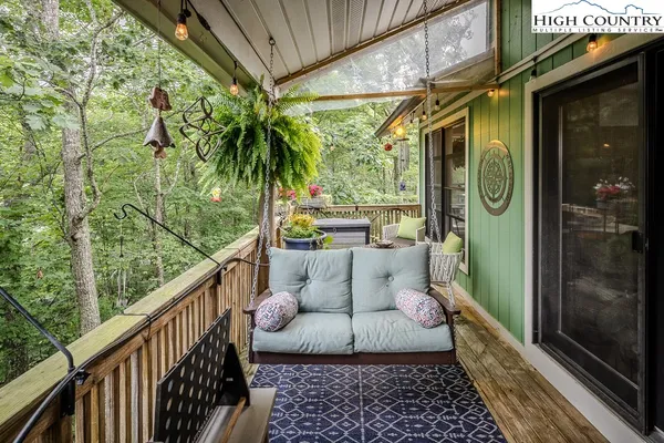 a view of balcony with furniture