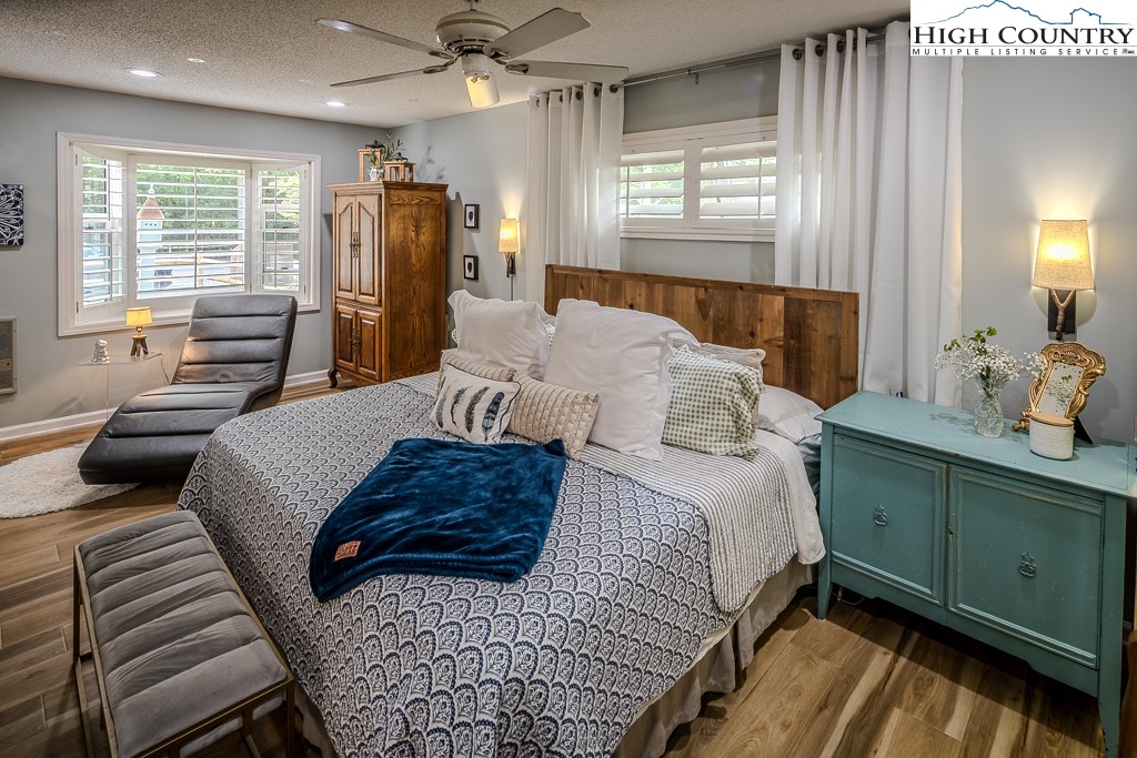 710 Pine Ridge Road Beech Mountain, NC 28604 - Photo 29 of 42 a bedroom with a bed and wooden floor
