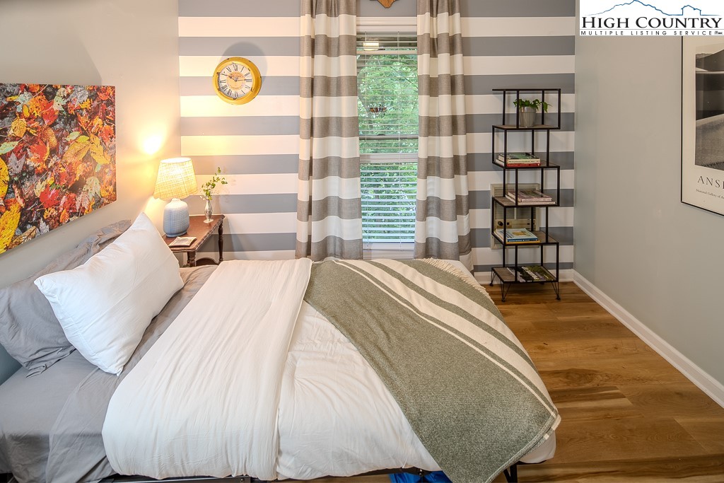 710 Pine Ridge Road Beech Mountain, NC 28604 - Photo 35 of 42 a bedroom with a bed and a window