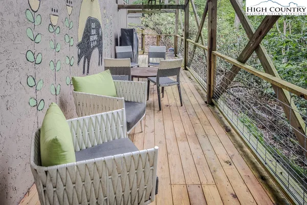 a view of balcony with furniture