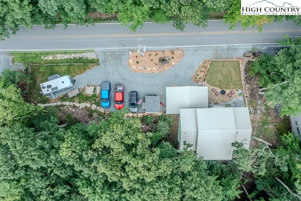 an aerial view of a house with outdoor space