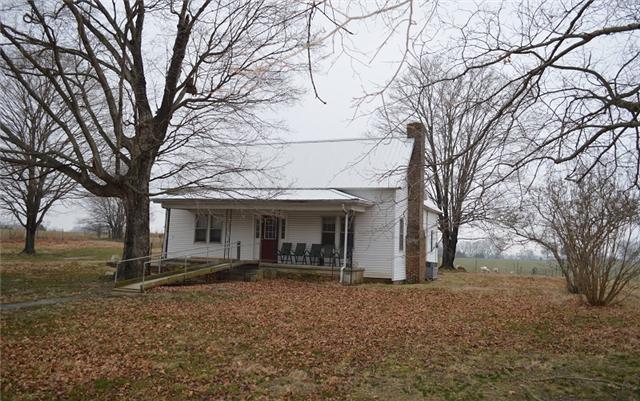877 Bells Mill Road Pelham, TN 37366 - Photo 1 of 20 a view of a house with a yard and large tree