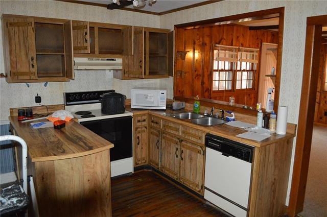 877 Bells Mill Road Pelham, TN 37366 - Photo 11 of 20 a kitchen with a sink stove and cabinets