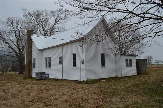 877 Bells Mill Road Pelham, TN 37366 - Photo 15 of 20 a view of a house with a yard