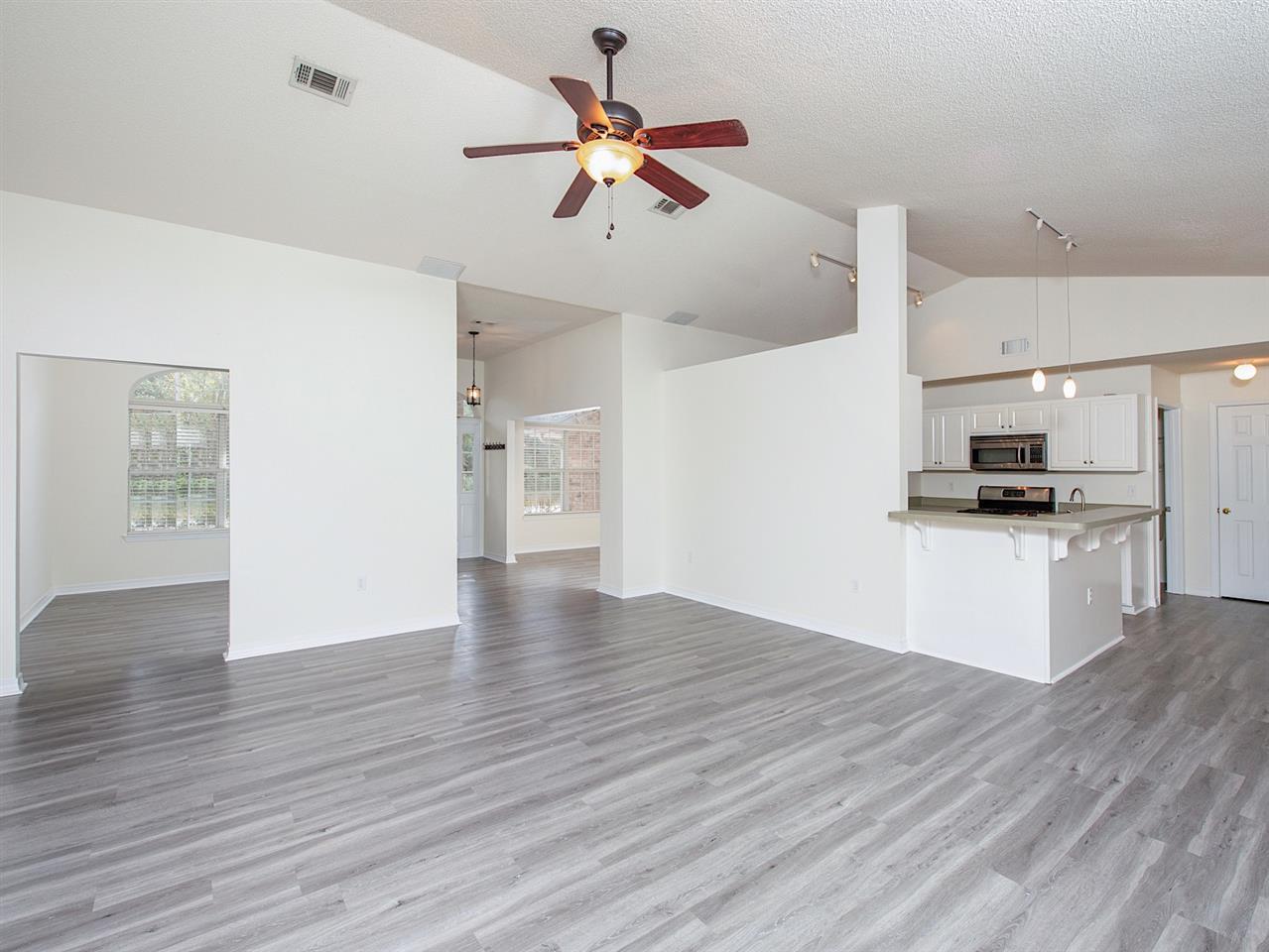 6852 Da Lisa Road Milton, FL 32583 - Photo 14 of 35 and dining room standing next to fireplace
