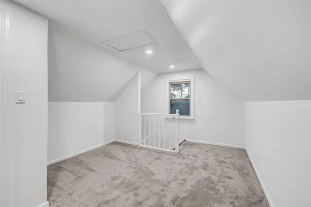 an empty room with a empty space and windows