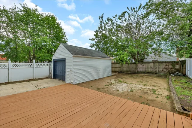 a view of a backyard with a large tree