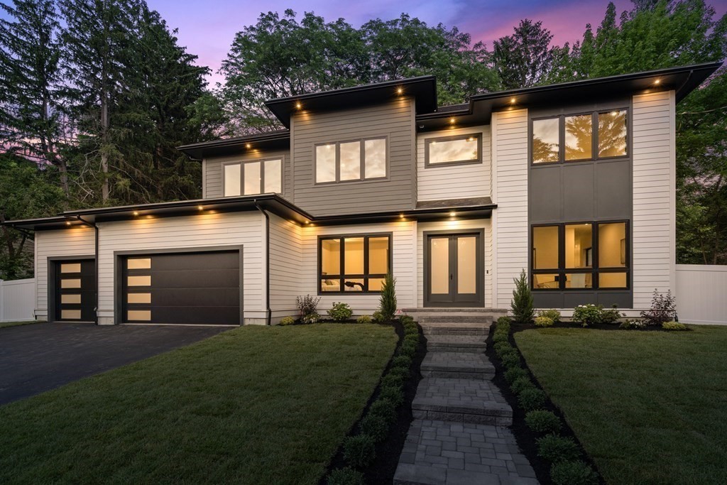 a front view of a house with a yard