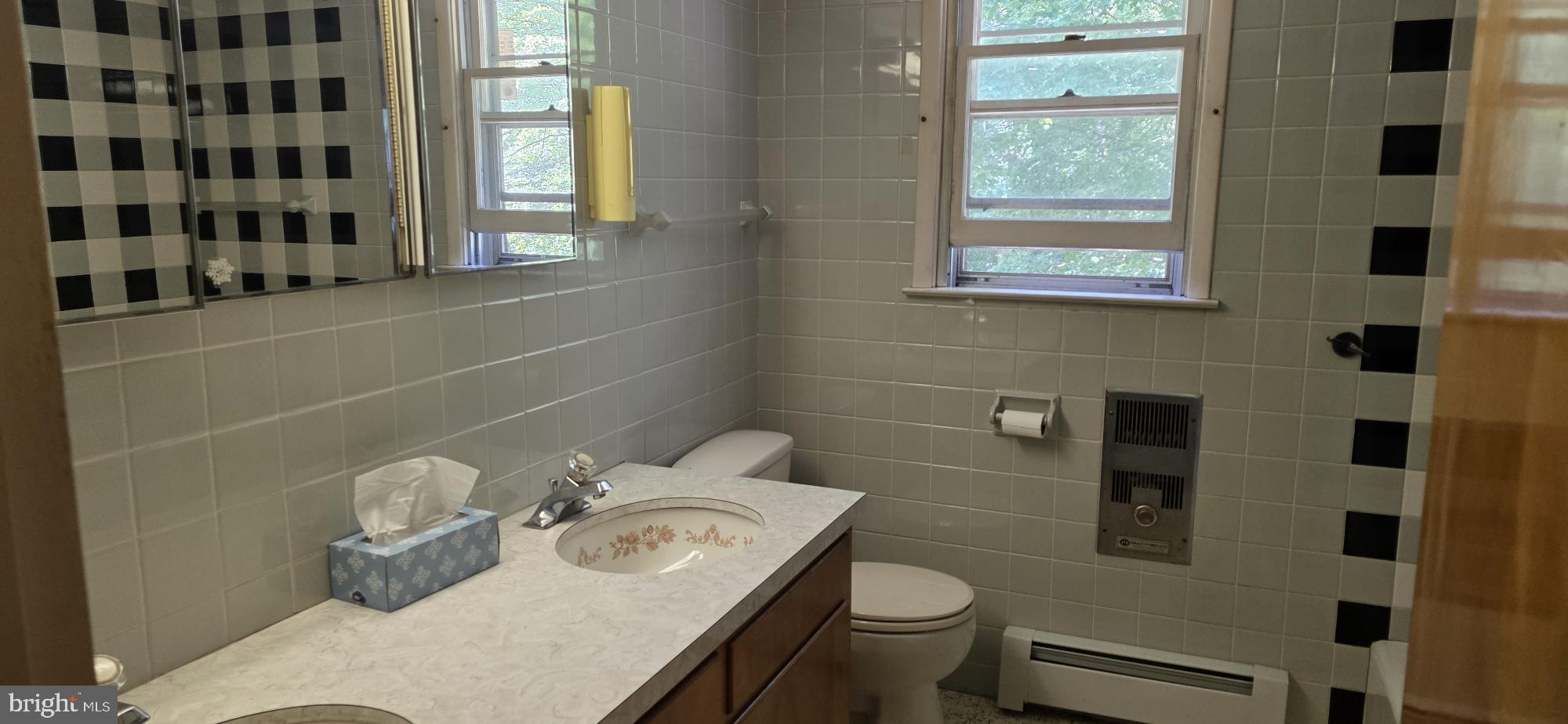 4819 Five Point Road New Tripoli, PA 18066 - Photo 43 of 52 a bathroom with a sink toilet and window