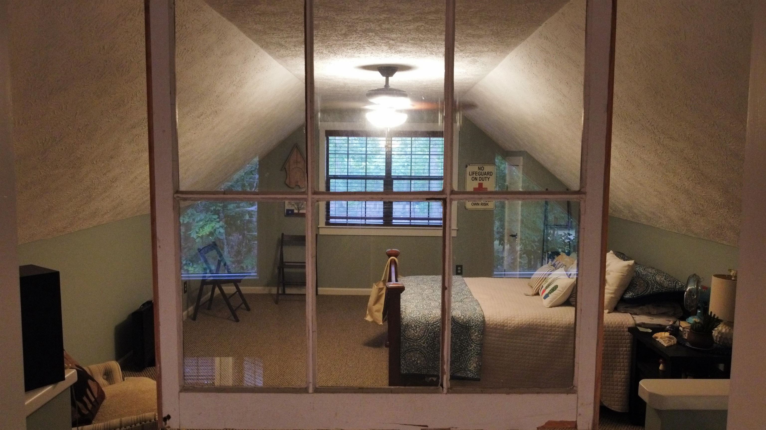 275 Bryson Harbor Road Counce, TN 38326 - Photo 22 of 23 Room featuring a sloped ceiling, carpeted flooring, and a ceiling fan with integrated lighting