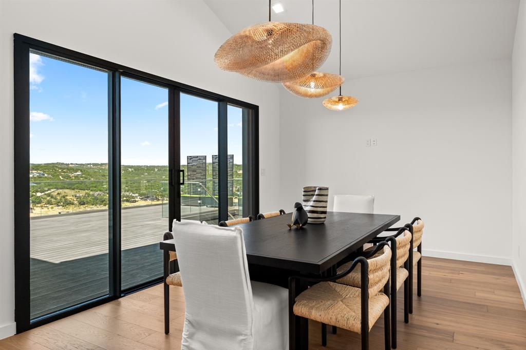 2714 Lakehurst Road Spicewood, TX 78669 - Photo 12 of 37 Dining area with light wood-style floors and baseboards