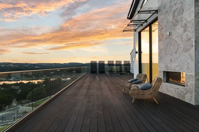 a bedroom with a large bed and a balcony view