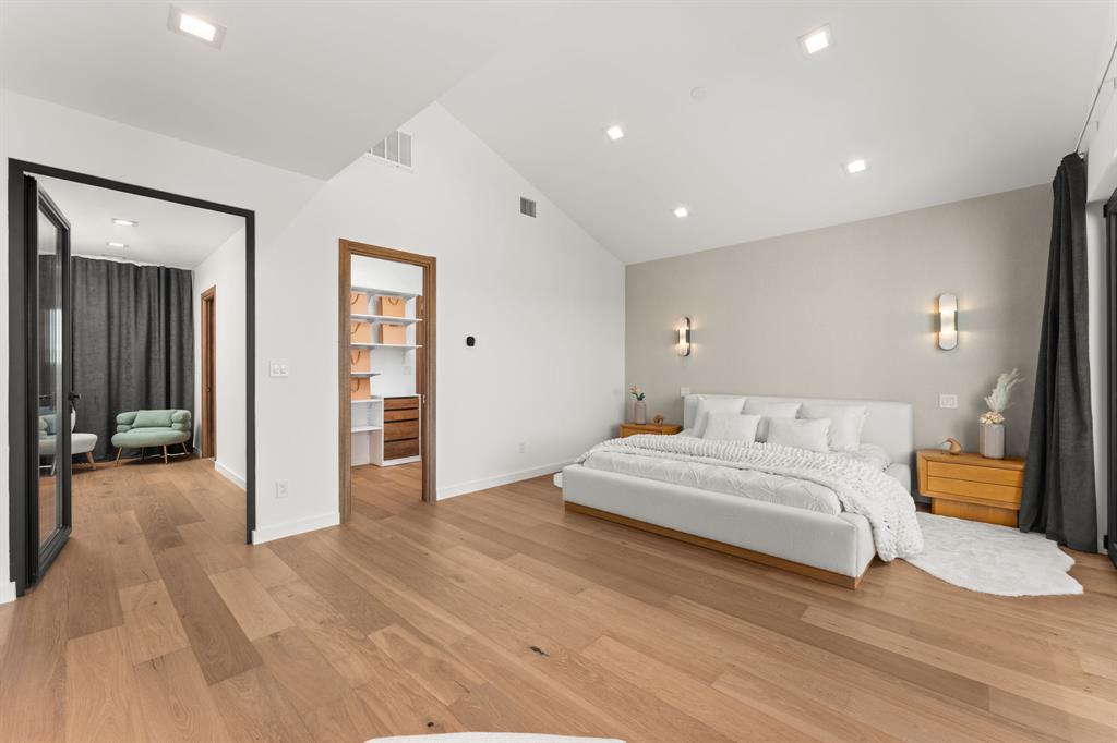 2714 Lakehurst Road Spicewood, TX 78669 - Photo 16 of 37 Bedroom featuring light wood-type flooring, high vaulted ceiling, and recessed lighting