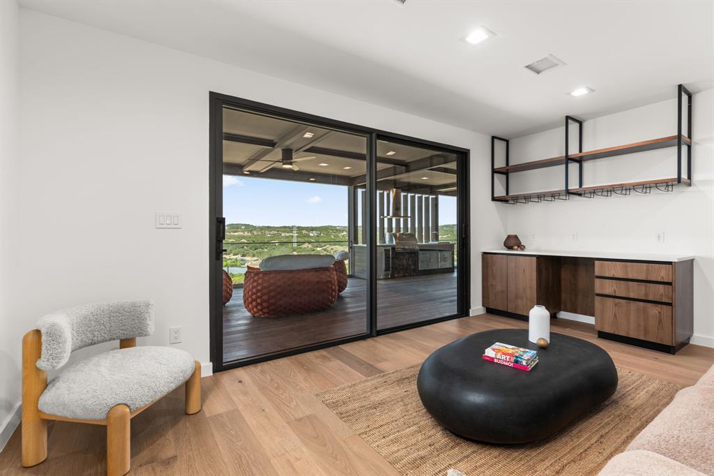 2714 Lakehurst Road Spicewood, TX 78669 - Photo 21 of 37 Sitting room featuring light wood-style floors and recessed lighting