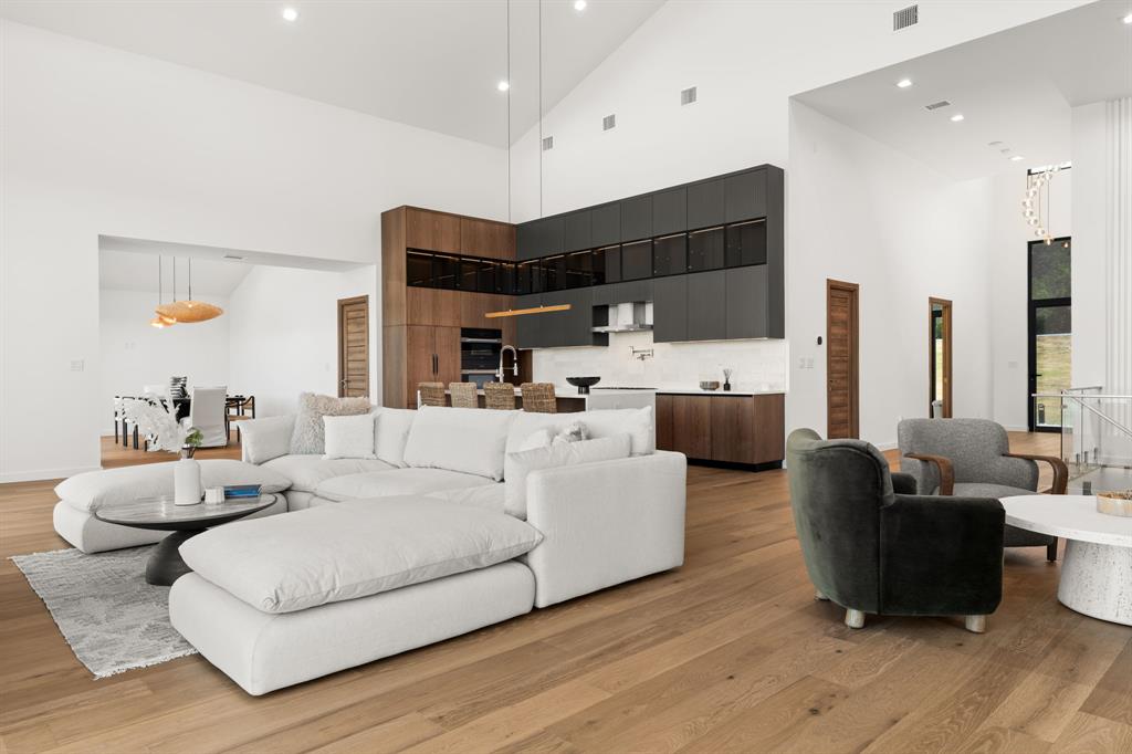 2714 Lakehurst Road Spicewood, TX 78669 - Photo 7 of 37 Living area with recessed lighting, light wood-style flooring, and high vaulted ceiling