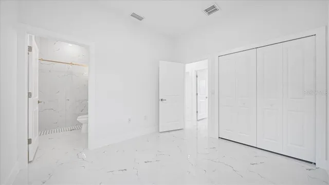 a bathroom with a shower and toilet