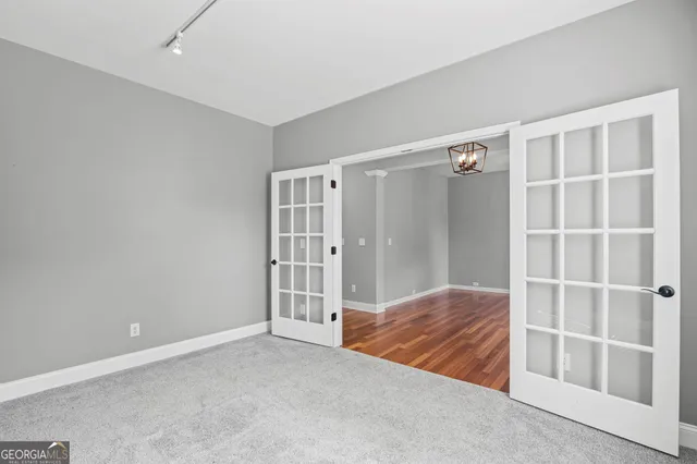 a view of entryway with wooden floor and door