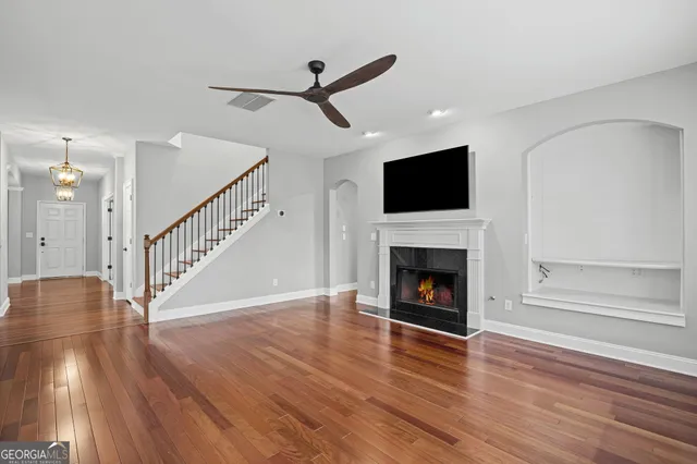a kitchen with stainless steel appliances granite countertop a sink and a stove