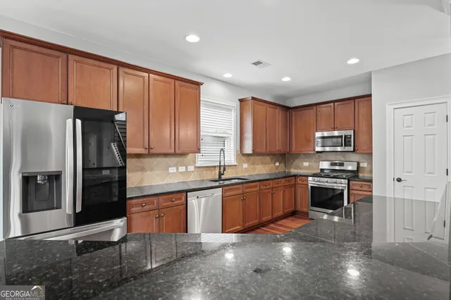 a view of a room with wooden floor and windows