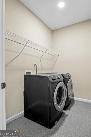 a living room with furniture and window