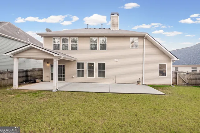 a view of a swimming pool with a yard