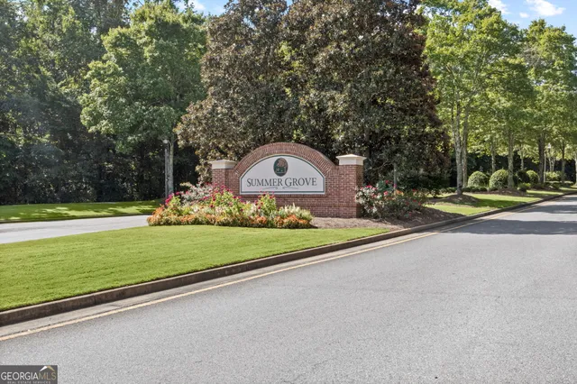a front view of multi story residential apartment building with yard