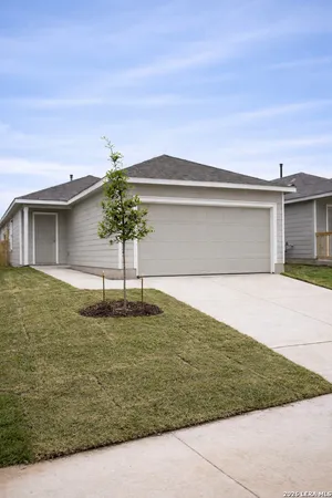 a house view with swimming pool in front of it