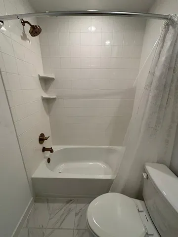a bathroom with a glass door shower and sink