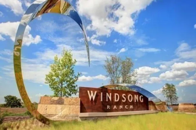 a view of swimming pool with an outdoor seating