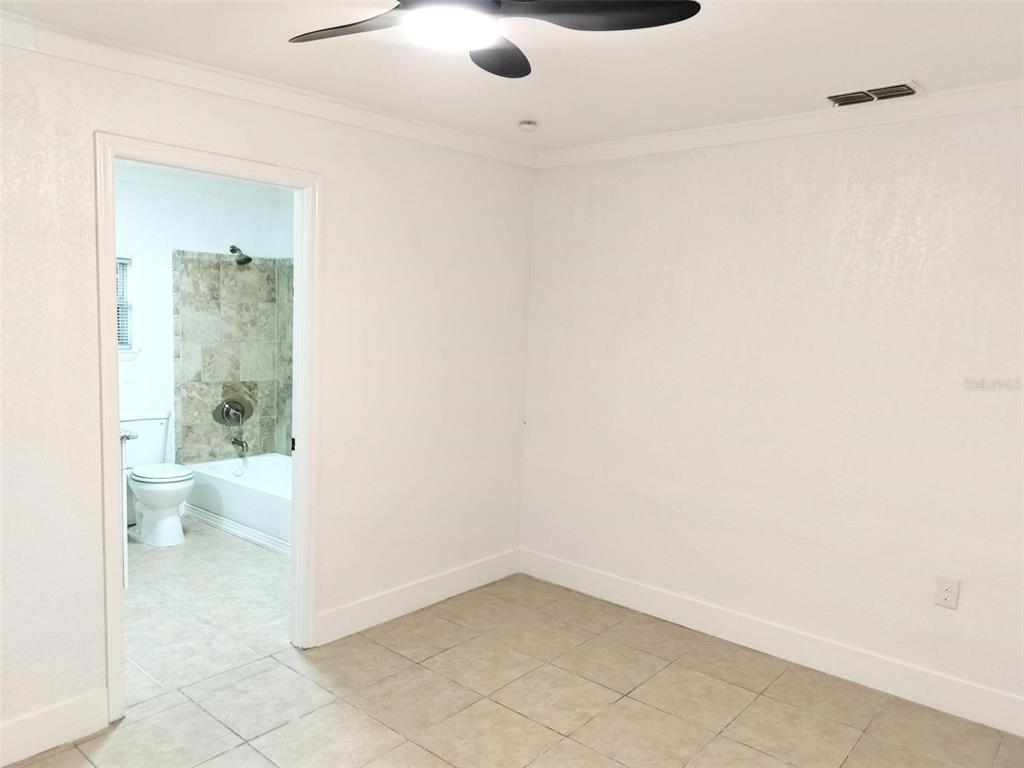 9901 Grace Drive Port Richey, FL 34668 - Photo 14 of 35 a bathroom with a toilet