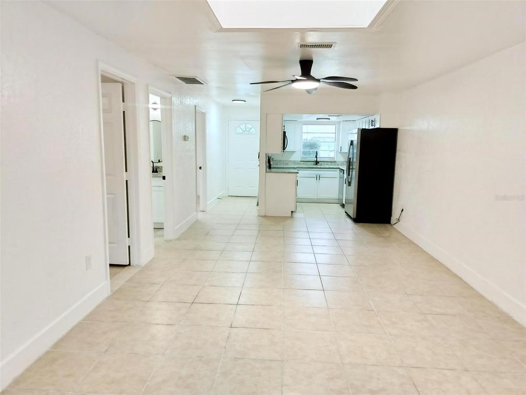 9901 Grace Drive Port Richey, FL 34668 - Photo 3 of 35 a view of a kitchen with a sink and a refrigerator