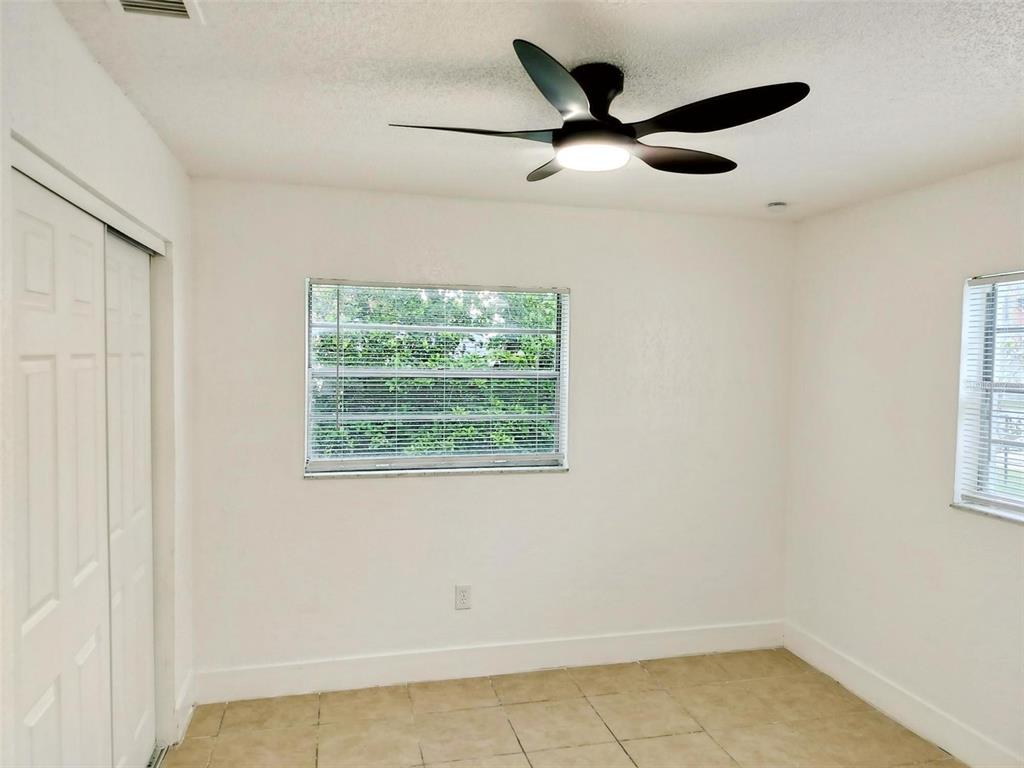 9901 Grace Drive Port Richey, FL 34668 - Photo 5 of 35 a view of a livingroom with a ceiling fan & a window