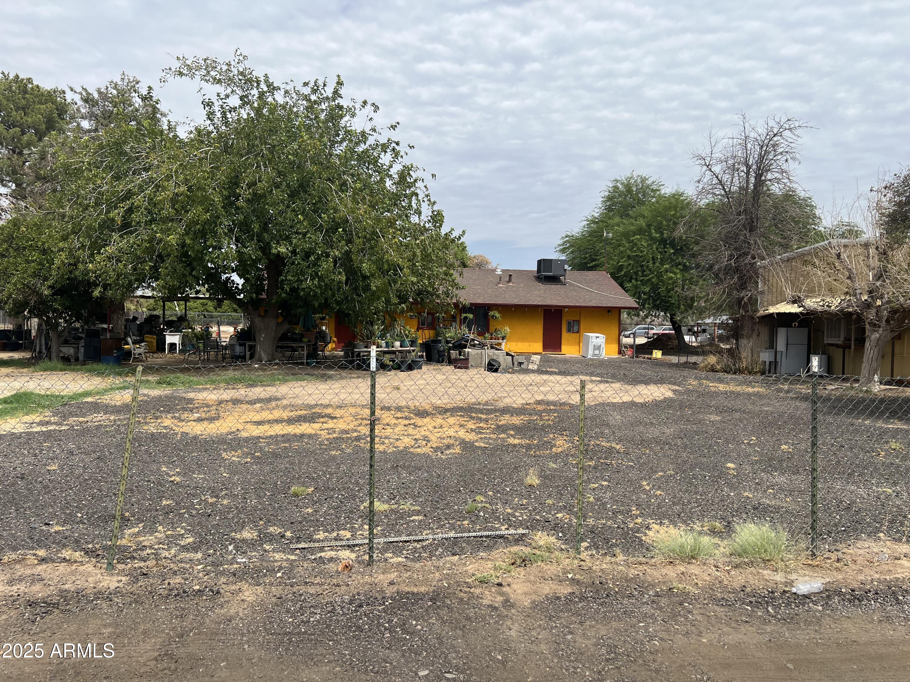 7621 North Alsup Road, Unit REAR Litchfield Park, AZ 85340 - Photo 4 of 26 a front view of a house with a yard and garage